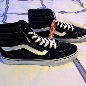 Vans high top shoes.